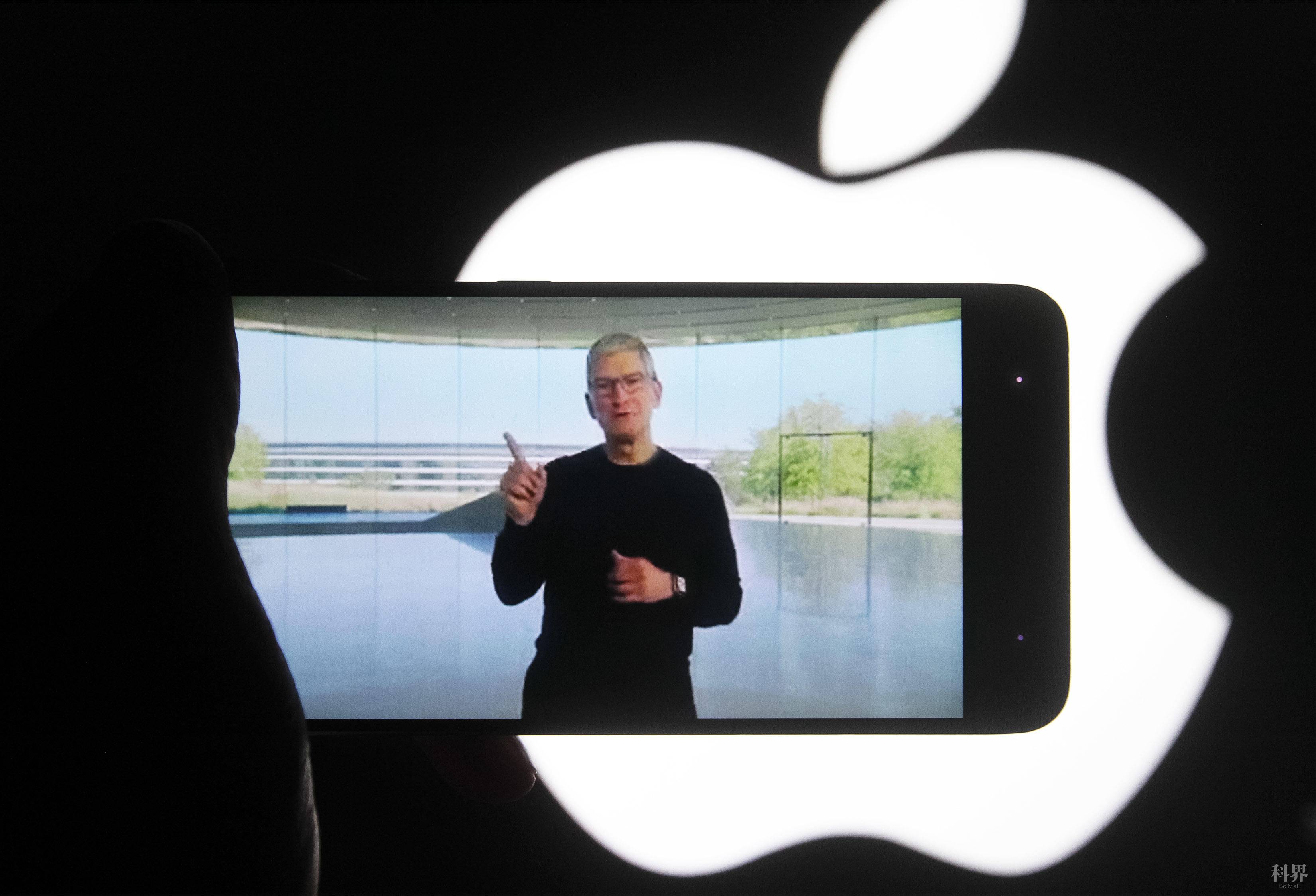 UKRAINE - 2020/10/13: In this photo illustration a screenshot of Apple's CEO Tim Cook from Apple's launch promotional material of the the new iPhone12 seen displayed on a smartphone screen with the apple logo in the background. (Photo Illustration by Pavlo Gonchar/SOPA Images/LightRocket via Getty Images)