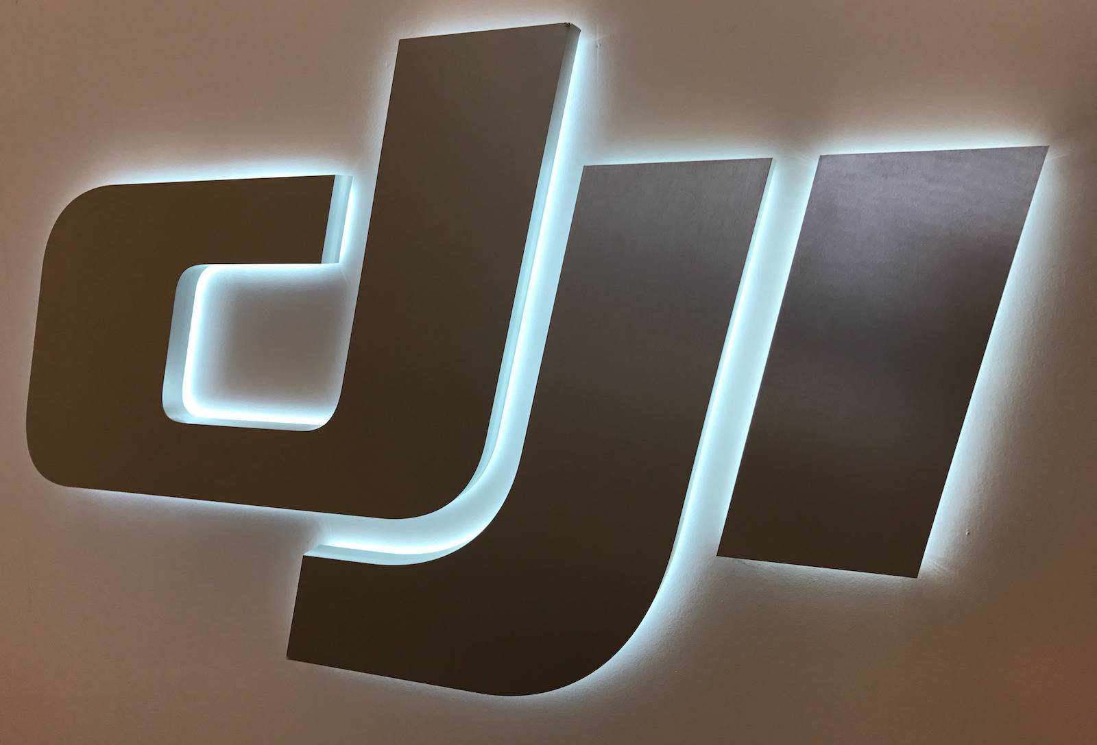 the logo of chinese drone maker dji is seen at the companys